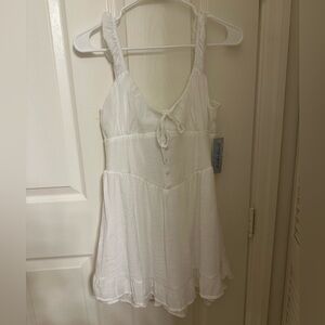 White Sleeveless Dress with Button Detail